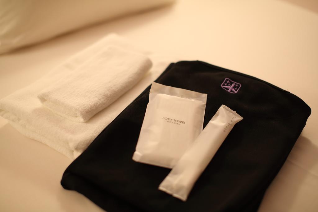 First Cabin Shinbashi Atagoyama Токио Номер фото
